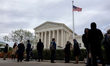 People wait in line outside the Supreme Court in Washington DC