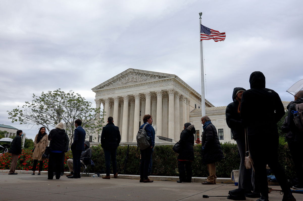 <i>Anna Moneymaker/Getty Images</i><br/>People wait in line outside the Supreme Court in Washington DC