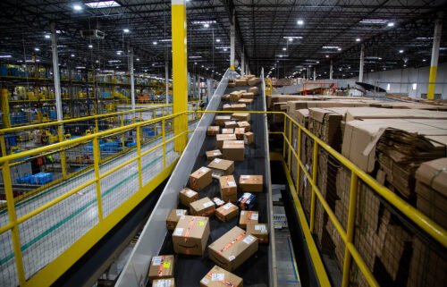 Packages move along a conveyor at an Amazon fulfillment center on Cyber Monday in Robbinsville