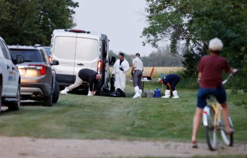 A police forensics team investigates a crime scene after multiple people were killed last month in Saskatchewan