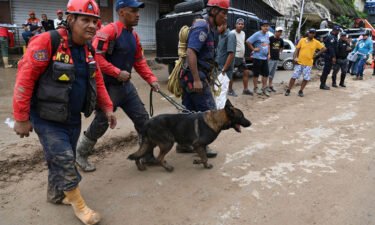 Rescuers look for survivors of the landslide in Las Tejerias