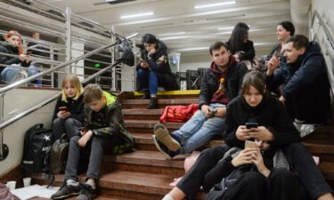 Ukrainians shelter inside a metro station after a missile attack in Kyiv on October 31.
