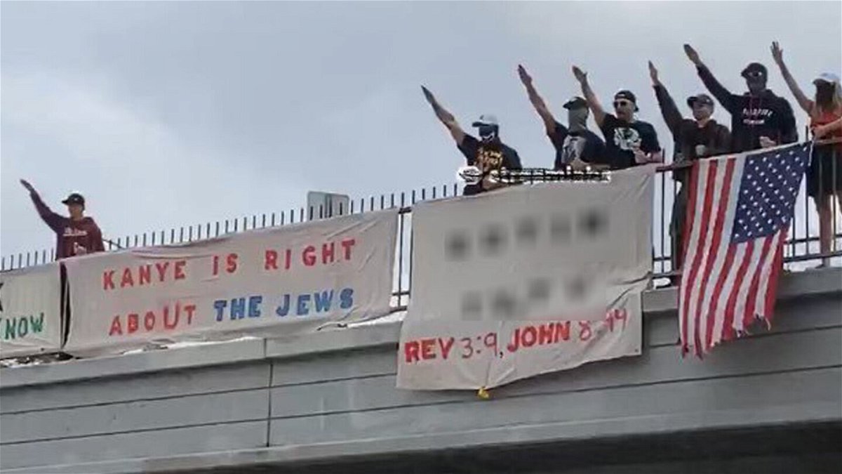 <i>Karen Bass/@KarenBassLA</i><br/>A photograph shared on the verified campaign Twitter account of Los Angeles mayoral candidate Karen Bass shows a group of demonstrators with banners showing support for rapper Kanye West's recent antisemitic remarks on a Los Angeles freeway overpass Saturday. CNN has blurred a portion of the image that included a reference to a website with antisemitic content.