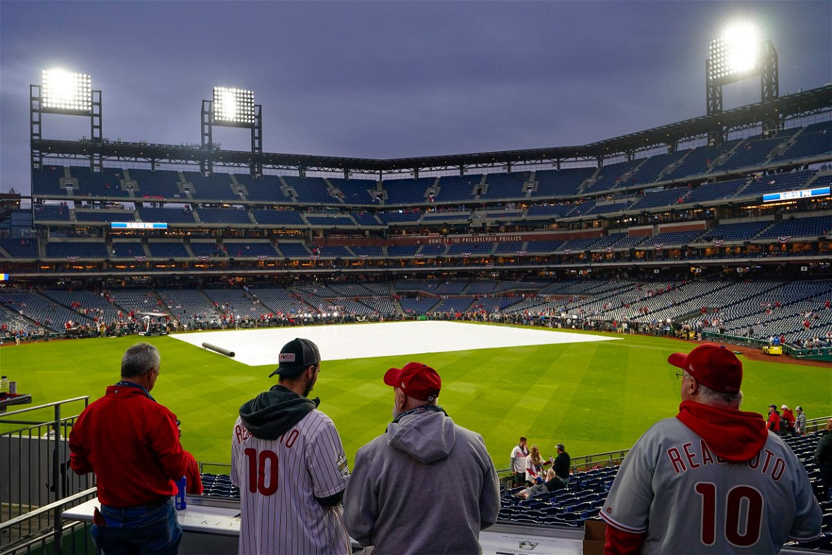 <i>Matt Rourke/AP</i><br/>Fans arrive for the World Series Game 3 between the Houston Astros and the Philadelphia Phillies on October 31 in Philadelphia. Game 3 of the World Series has been postponed because of rain in Philadelphia.