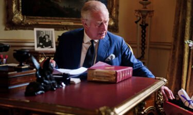 King Charles III is pictured in September carrying out official government duties at Buckingham Palace.