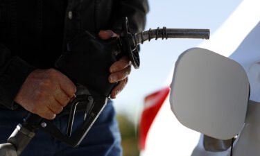 Gas prices are on the rise again. A customer fuels up his car at a gas station in Erlanger