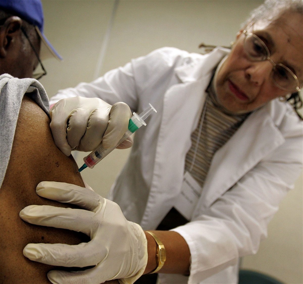 <i>Tim Boyle/Getty Images North America/Getty Images</i><br/>Flu season has ramped up early in the United States and flu hospitalizations are worse than usual for this time of year. Robert Garner (left) receives a flu shot from registered nurse Betty Lewis in 2006 in Chicago.