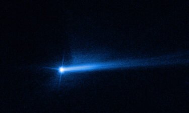 Two tails of dust ejected from the Didymos-Dimorphos asteroid system are visible in an image from the Hubble Space Telescope