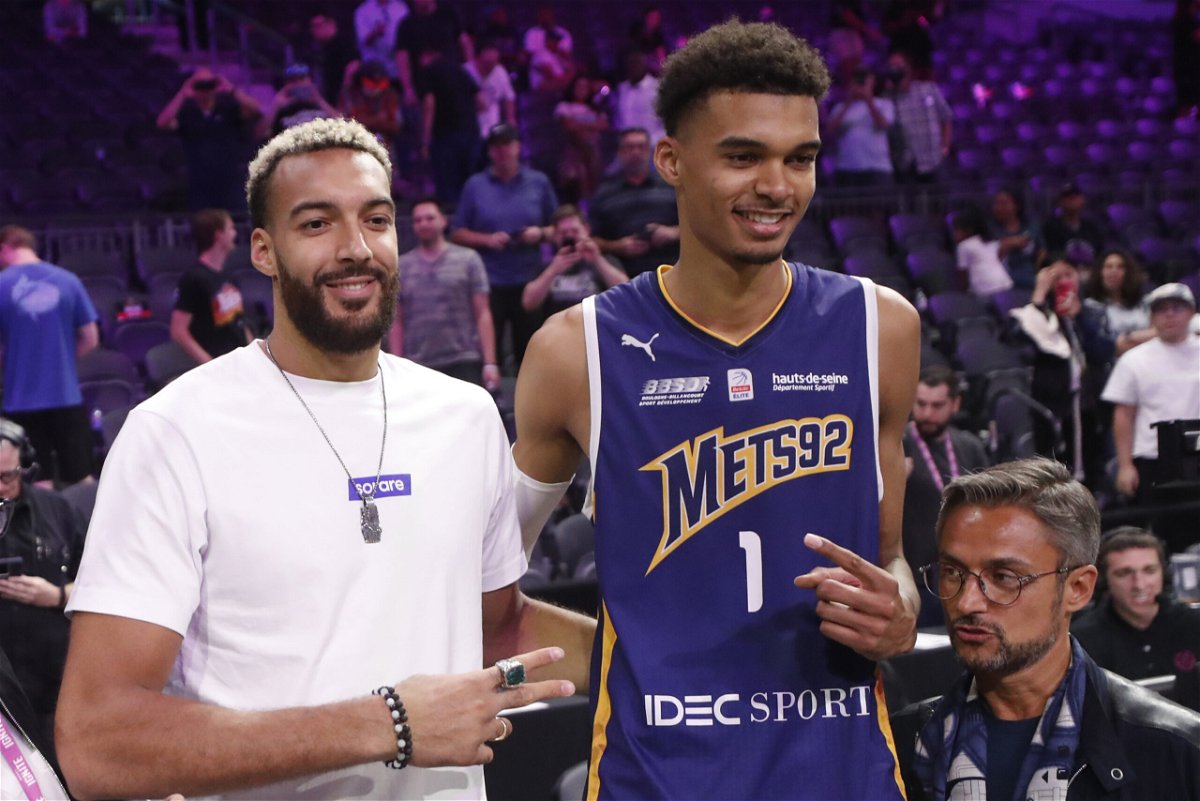 <i>Steve Marcus/Getty Images North America/Getty Images</i><br/>Rudy Gobert (L) poses next to Victor Wembanyama after an exhibition game on October 6.