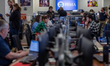 Technicians monitor Hurricane Ian at FEMA headquarters in Washington