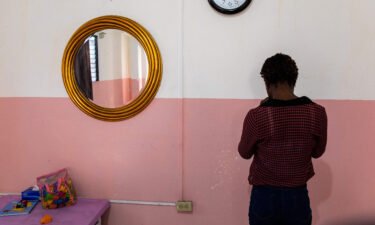 An anonymous victim of sexual abuse poses for a photo at the Doctors Without Borders' "Pran men'm" clinic in Delmas 33 comune