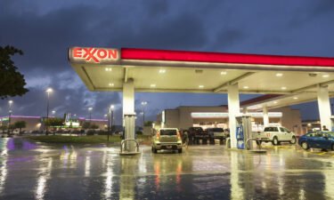 ExxonMobil's profit set a record for the second straight quarter as oil and gas prices remained high. An Exxon gas station in Dallas
