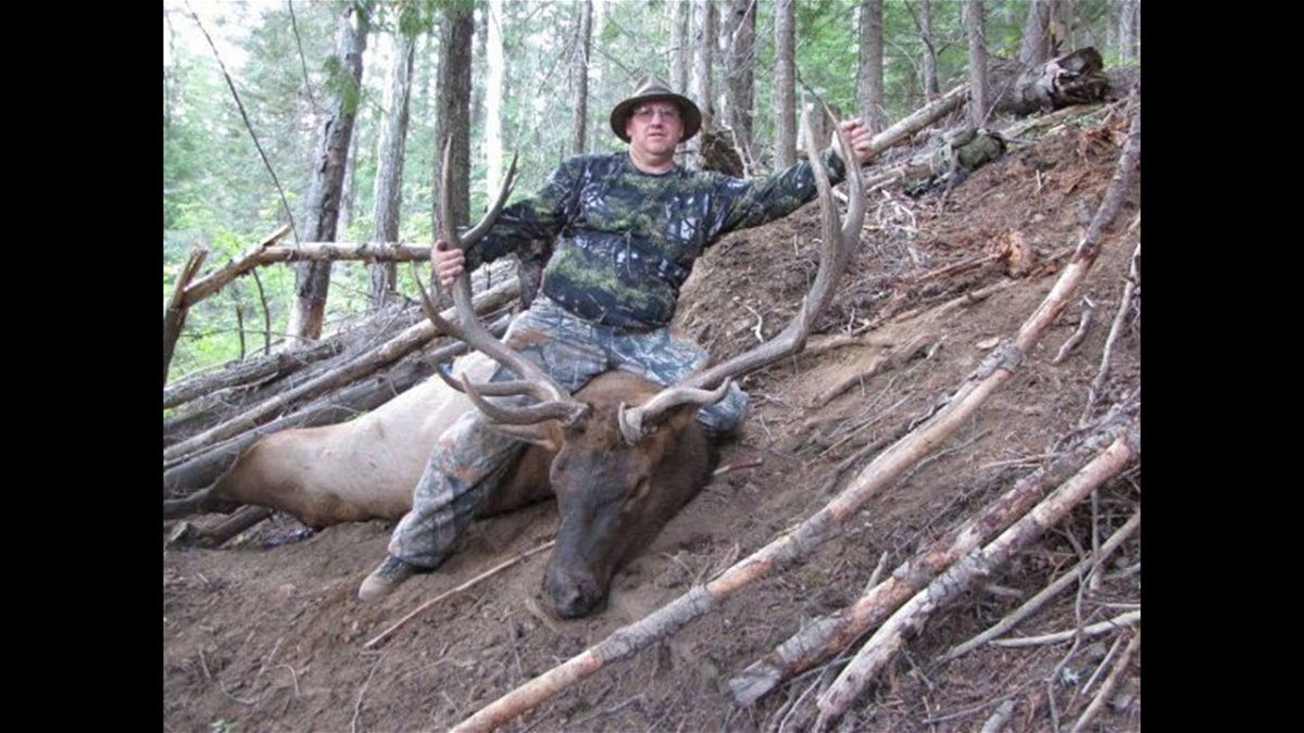 Hunter with his bull elk