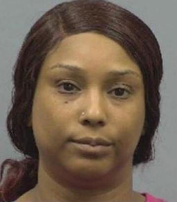 <i>Sanford Police/WRAL</i><br/>Marie Shavone Debrow was charged after police say she pointed a gun at another woman in a school parking lot and fired the weapon.