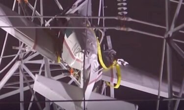 The pilot of a small plane that crashed Sunday into a power line tower managed to stay very calm during his call to 911.