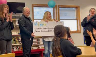 Librarian Cherie Simpson presented check at Stalker Elementary