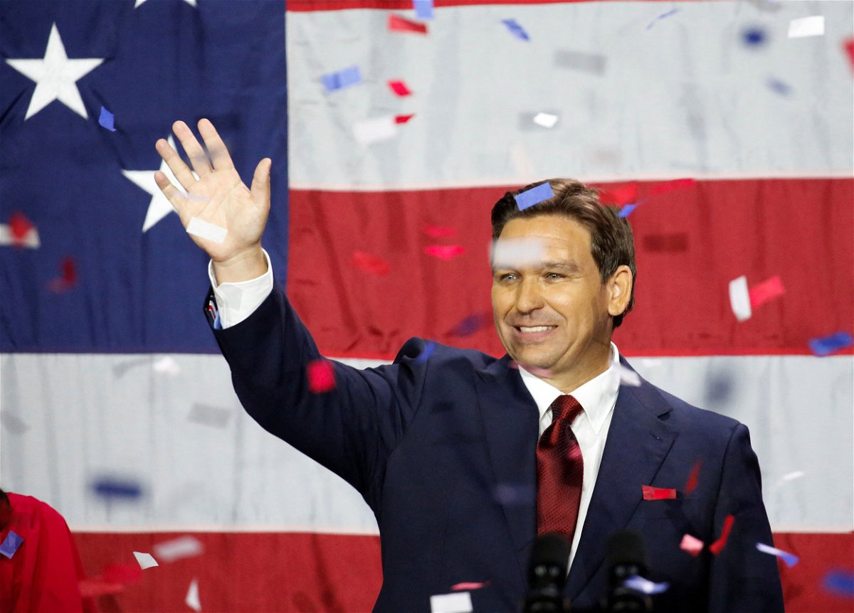 <i>Marco Bello/Reuters</i><br/>Republican Gov. Ron DeSantis of Florida celebrates onstage on election night in Tampa on November 8. Republicans had hoped to make big enough gains among Latino voters in 2022