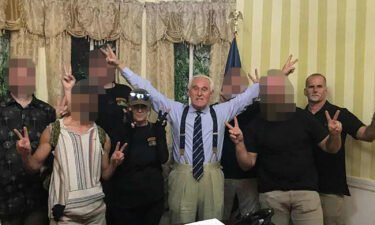 Roger Stone poses with Connie Meggs and Graydon Young