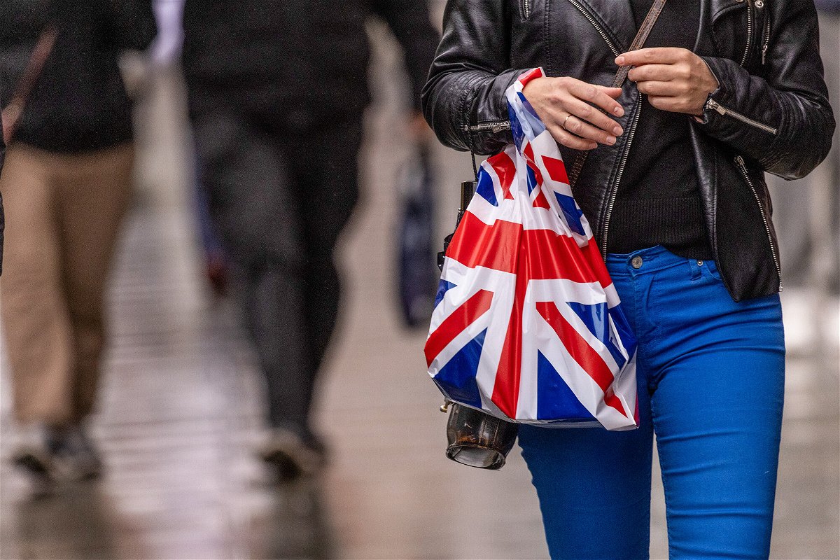 <i>Jason Alden/Bloomberg/Getty Images</i><br/>A shopper carries a shopping bag along Oxford Street in central London on November 7.