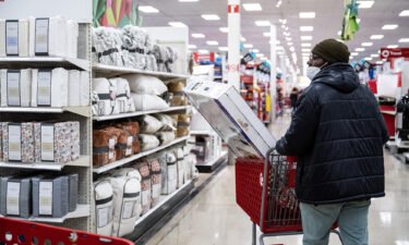 Consumers still don't feel great about their finances. A shopper is pictured at a Target store on Black Friday in Chicago