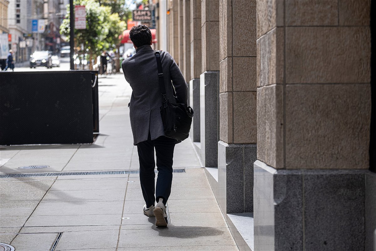 <i>David Paul Morris/Bloomberg/Getty Images</i><br/>The number of job openings rose unexpectedly in September. A pedestrian walks in the financial district of San Francisco