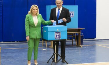 Former Israeli Prime Minister and Likud party leader Benjamin Netanyahu and his wife Sara Netanyahu cast their vote in the Israeli general election on November 1 in Jerusalem
