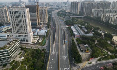 China has locked down a major transportation hub in the south over a Covid-19 outbreak. Pictured is an empty highway in Guangzhou