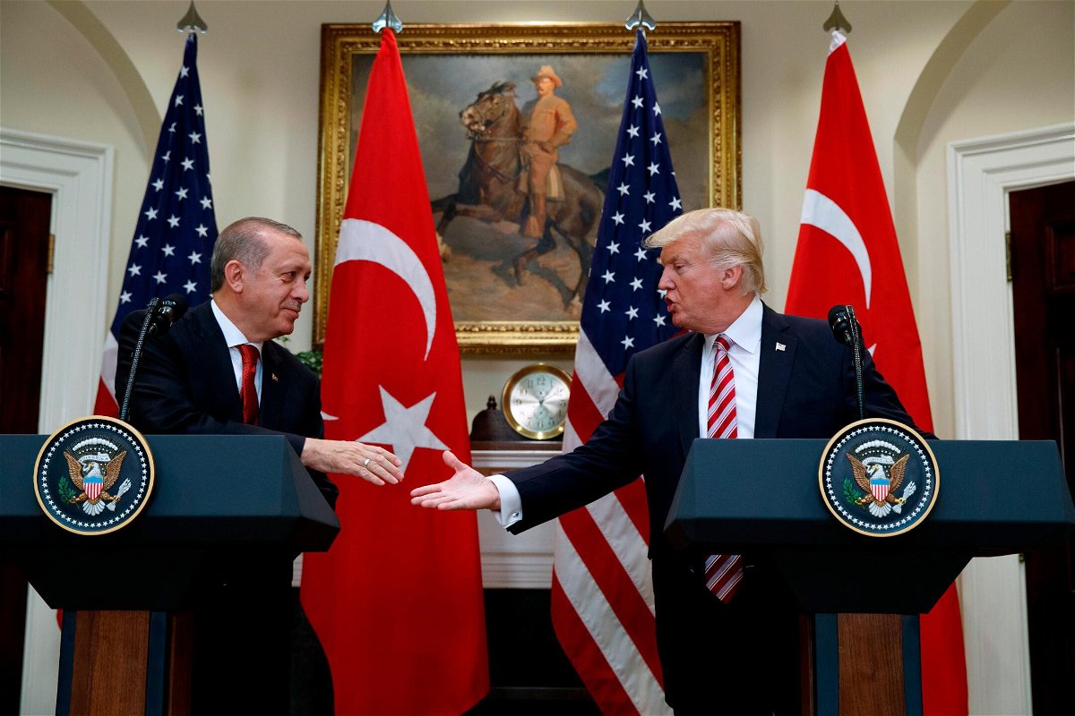 <i>Evan Vucci/AP</i><br/>President Donald Trump shakes hands with Turkish President Recep Tayyip Erdogan in the Roosevelt Room of the White House