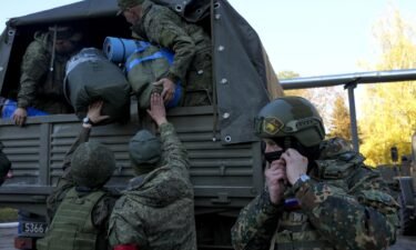 Russian citizens drafted during the country's partial mobilization are seen being dispatched to combat coordination areas in Moscow