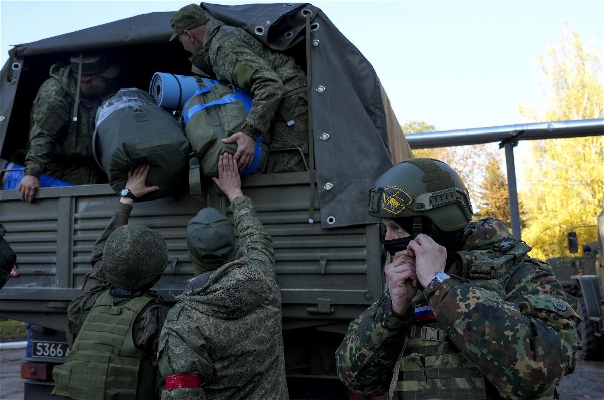 <i>Stringer/Anadolu Agency/Getty Images</i><br/>Russian citizens drafted during the country's partial mobilization are seen being dispatched to combat coordination areas in Moscow