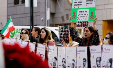 People shout slogans during a protest for the children of Iran at UNICEF headquarters in New York City on November 10.