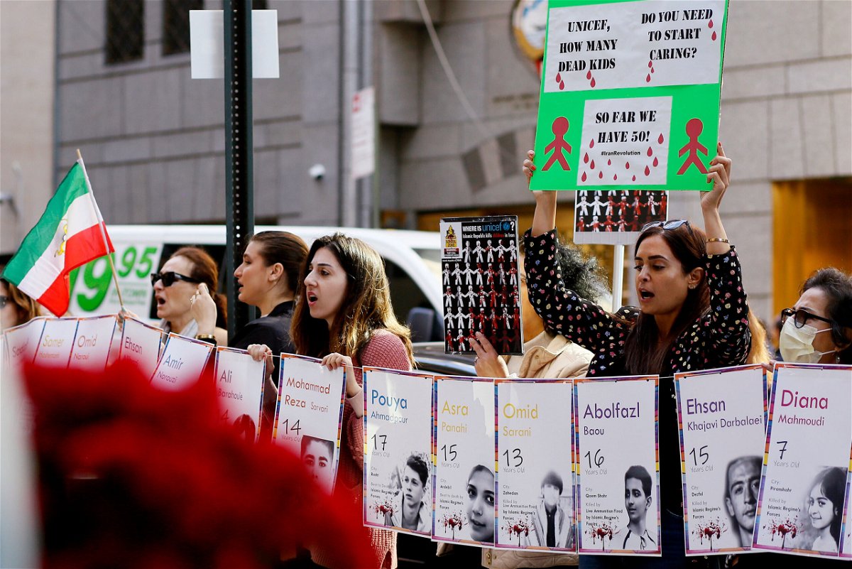 <i>Leonardo Munoz/VIEWpress/Getty Images</i><br/>People shout slogans during a protest for the children of Iran at UNICEF headquarters in New York City on November 10.