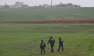 Members of the Police searching the fields near the village of Przewodow in the Lublin Voivodeship