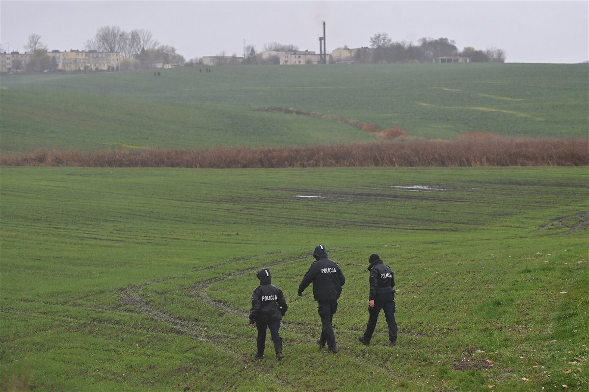 <i>Artur Widak/Anadolu Agency/Getty Images</i><br/>Members of the Police searching the fields near the village of Przewodow in the Lublin Voivodeship