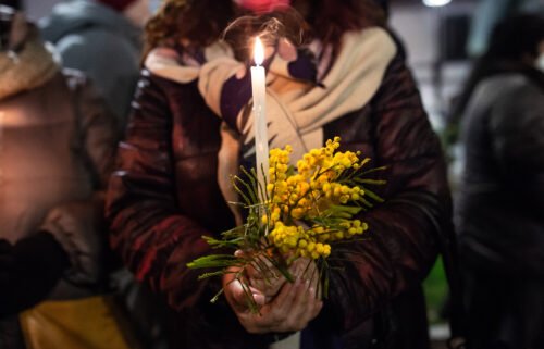 More than 100 women were murdered in Italy so far this year. A woman holds a candle during the torchlight procession against Anna Borsa's femicide on March 1