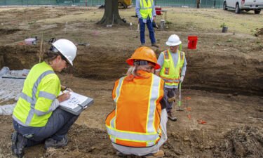 State archaeologist Kary Stackelbeck makes notes at an excavation site at Oaklawn Cemetery while searching for victims of the 1921 Tulsa Race Massacre