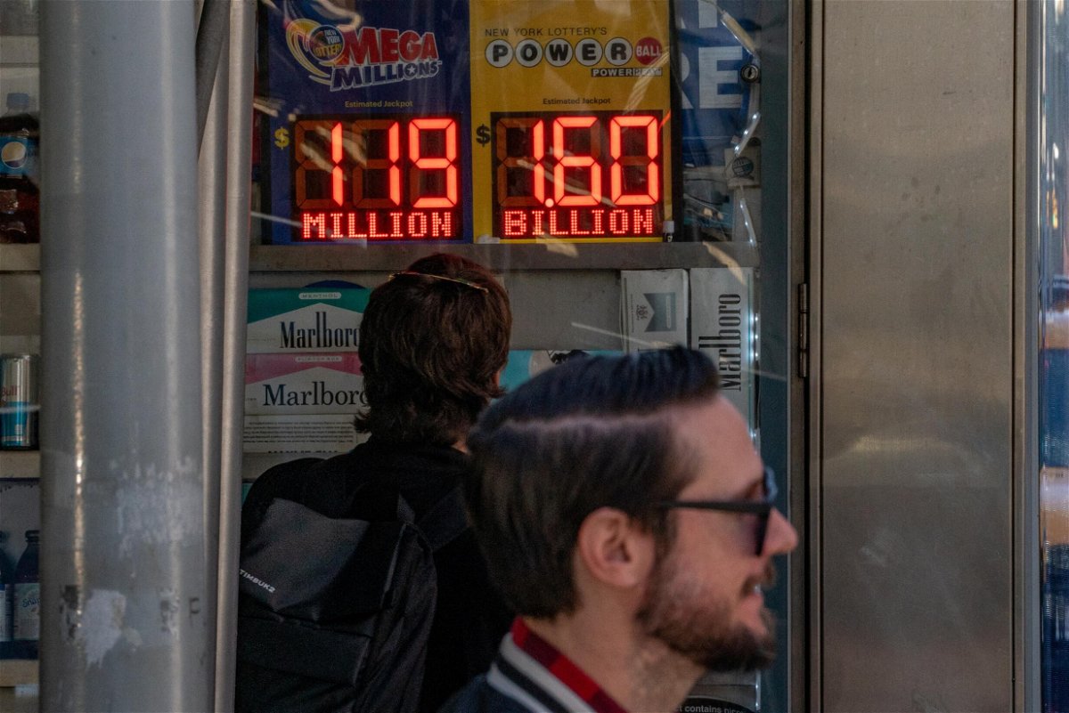 <i>David 'Dee' Delgado/Reuters</i><br/>A person looks at a digital billboard advertising Powerball's Jackpot of 1.6 billion dollars in New York City