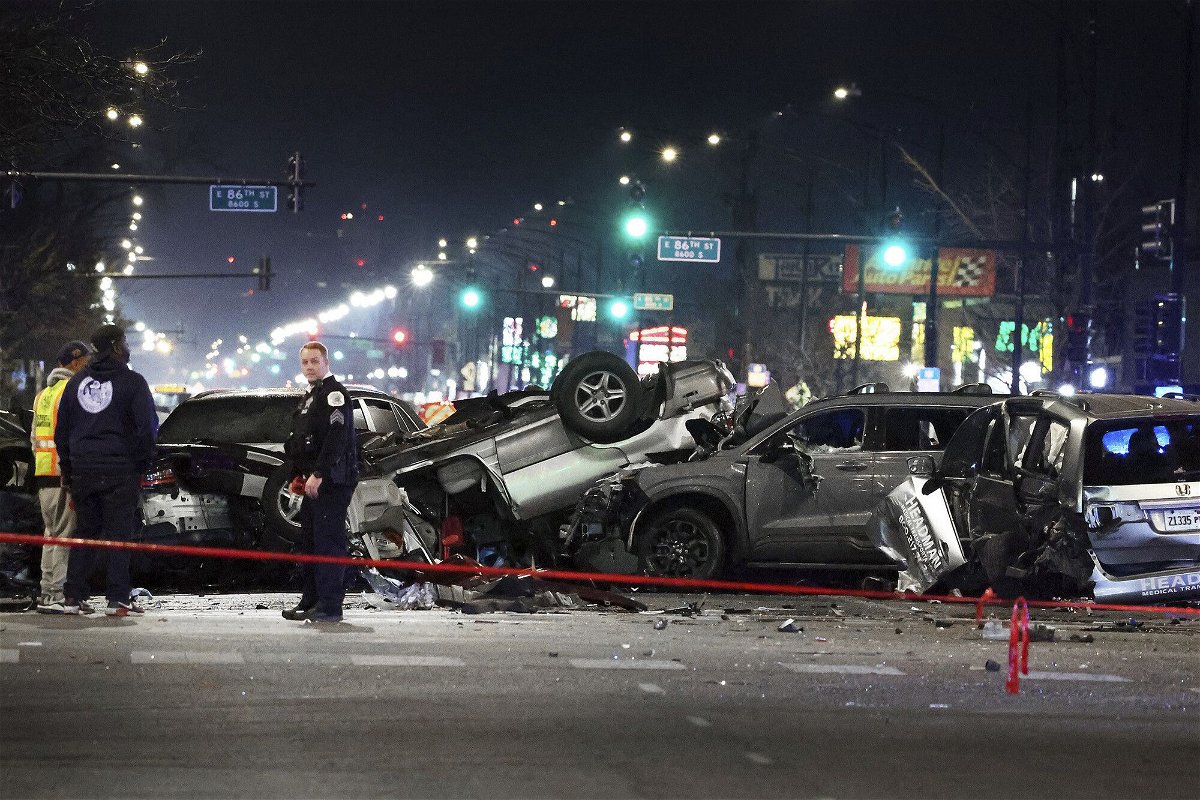 <i>Terrence Antonio James/Chicago Tribune/TNS/Getty Images</i><br/>Chicago police process the double fatal crash scene at 87th Street and Cottage Grove Avenue in Chicago that sent drivers and passengers in other vehicles to hospitals on Wednesday.