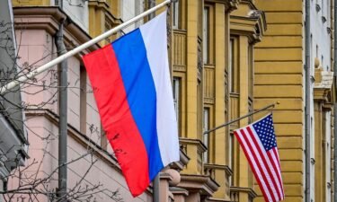 Russia postpones nuclear arms control talks with the United States. A Russian flag flies next to the US embassy building in Moscow on March 18
