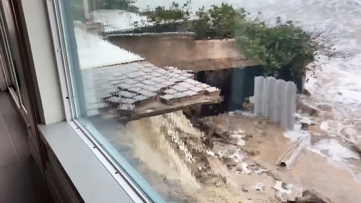 <i>WESH</i><br/>This image shows a bricked area outside a Florida home partially washed away