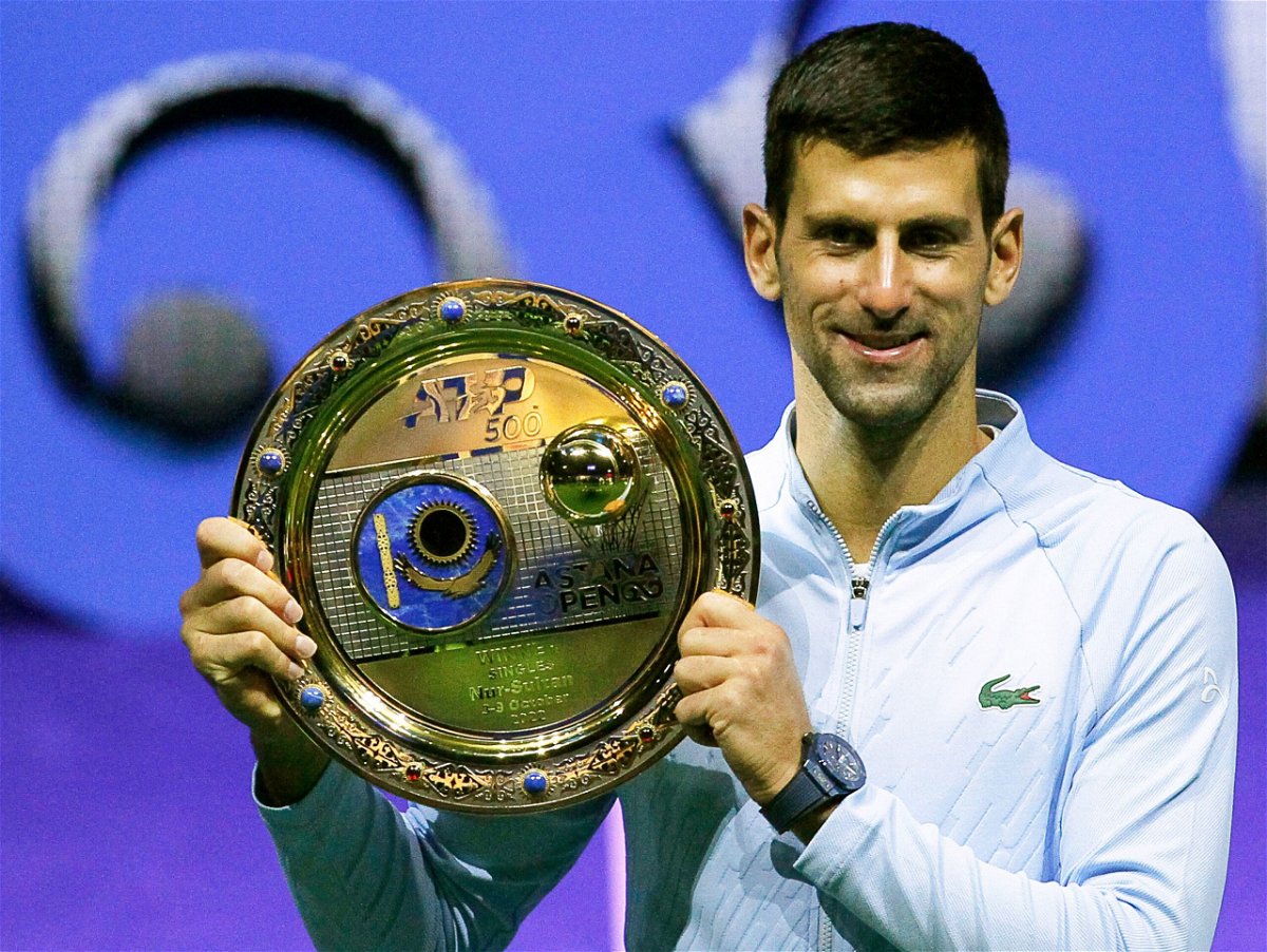 <i>-/AFP/AFP via Getty Images</i><br/>Australia will overturn Novak Djokovic Djokovic's visa ban. Djokovic here celebrates his victory at the Astana Open tennis tournament in Astana on October 9.