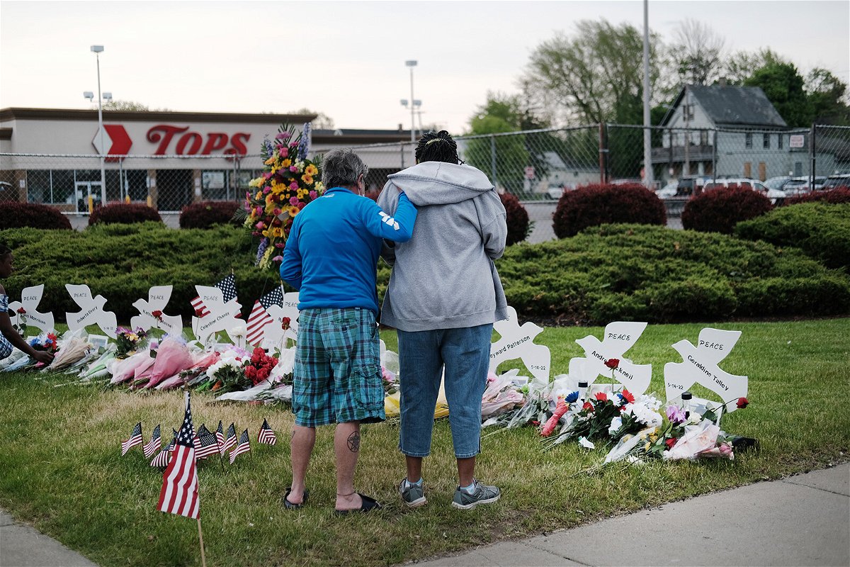 <i>Spencer Platt/Getty Images</i><br/>Buffalo Tops supermarket shooter is expected to plead guilty to state charges next week. People gather at a memorial outside of Tops market in Buffalo