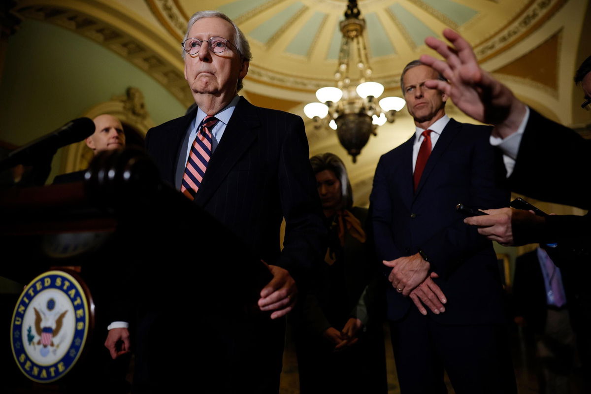 <i>Chip Somodevilla/Getty Images</i><br/>Senate Minority Leader Mitch McConnell talks to reporters in December 2021 in Washington