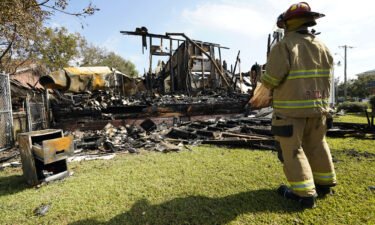 A fireman observes the remains of a burned Epiphany Lutheran Church near midtown Jackson
