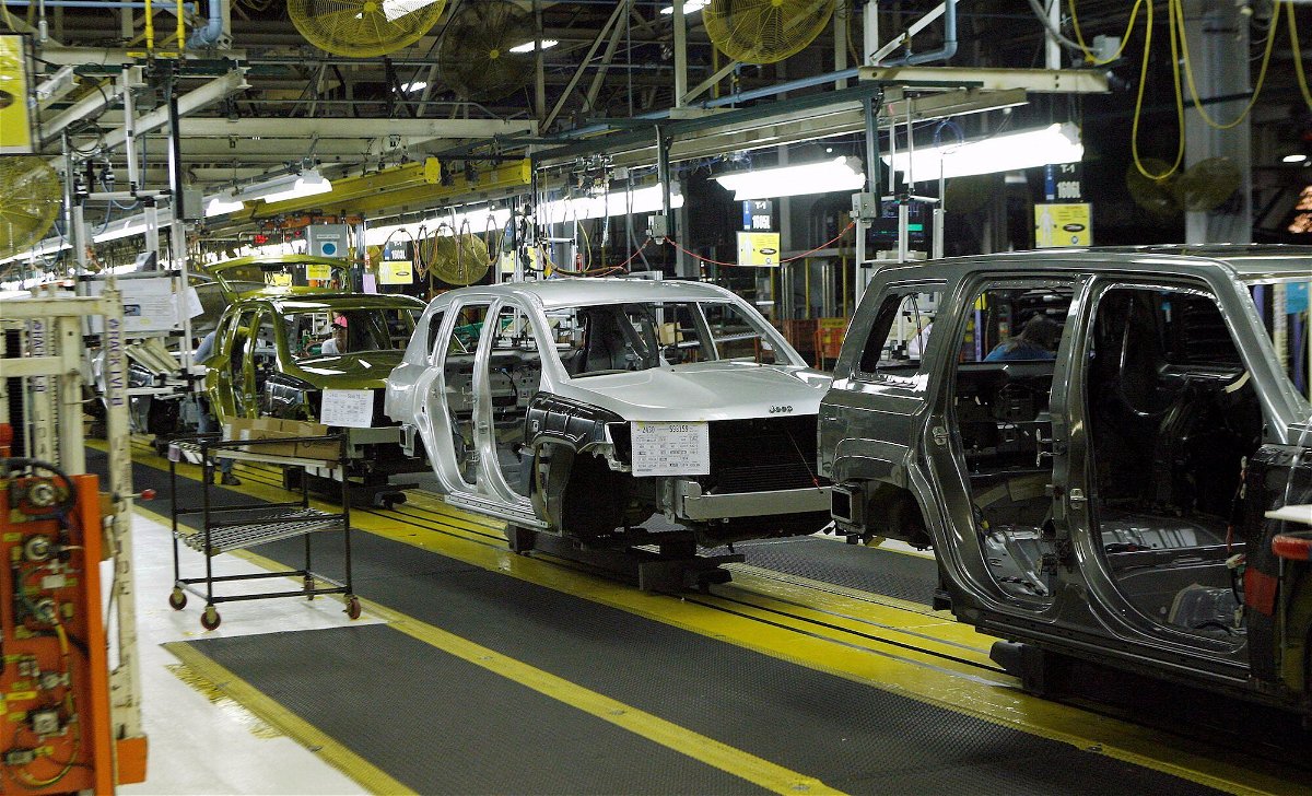 <i>Reuters</i><br/>Jeep Compass and Patriot vehicles move down an assembly line during a tour of the Chrysler Belvidere Assembly plant in Belvidere