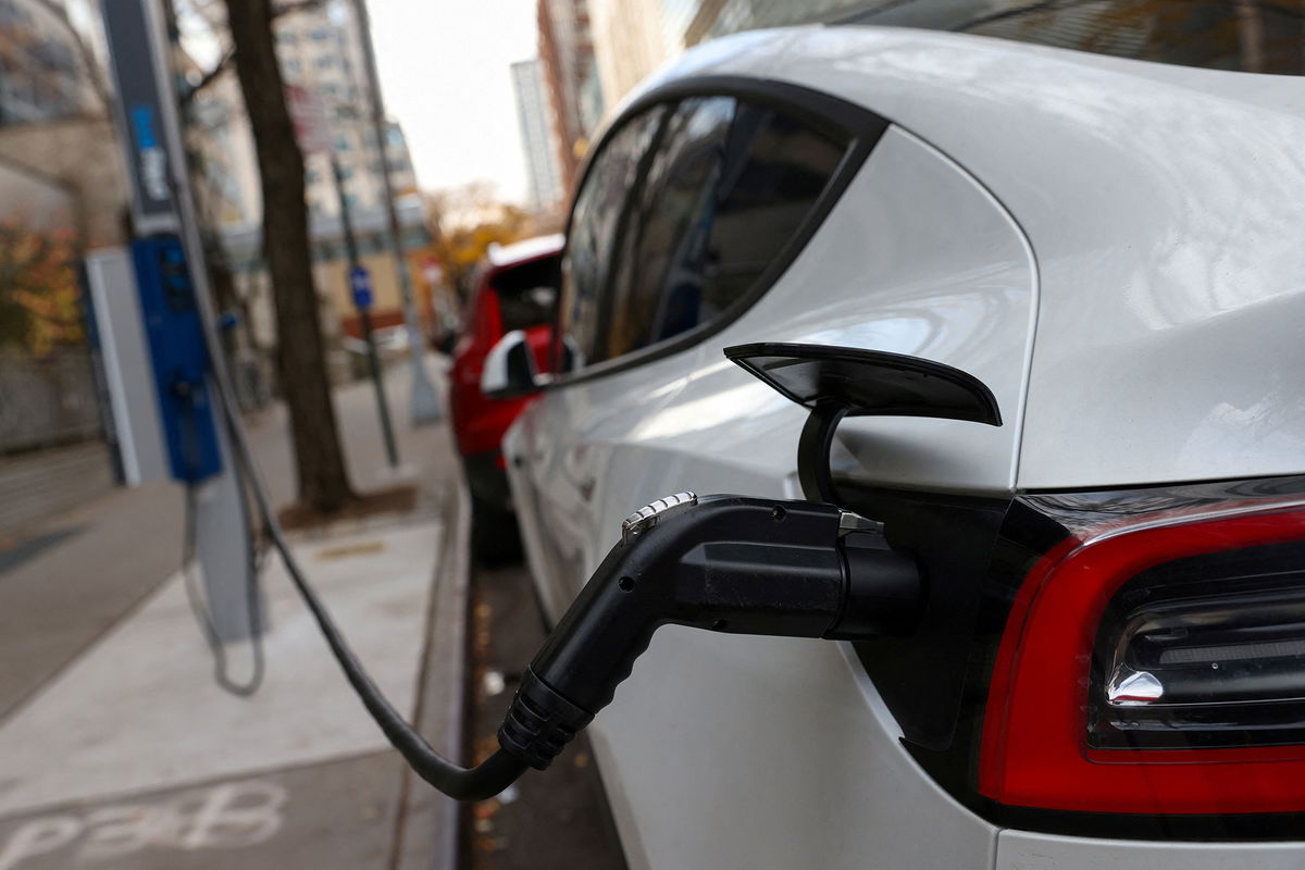 <i>Andrew Kelly/Reuters</i><br/>An electric vehicle is seen charging in Manhattan