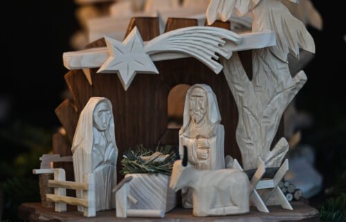 View of a wooden Nativity Scene on display at the Christmas Market on the Main Market Square in Krakow