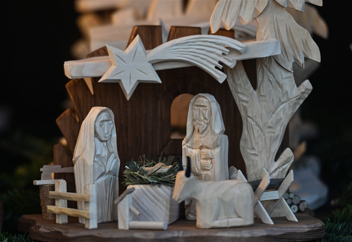 <i>Artur Widak/NurPhoto/Getty Images</i><br/>View of a wooden Nativity Scene on display at the Christmas Market on the Main Market Square in Krakow