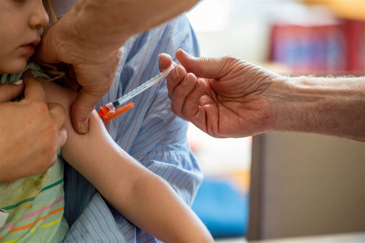 <i>Joseph Prezioso/AFP/Getty Images</i><br/>Children as young as 6 months can now receive an updated Covid-19 vaccine. A young child receives the Covid-19 vaccine in Needham