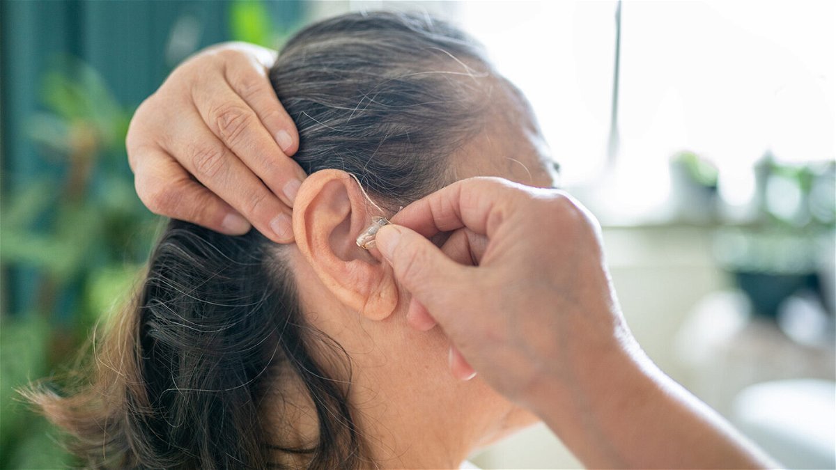 <i>Su Arslanoglu/E+/Getty Images</i><br/>Wearing hearing aids may lower your risk for cognitive decline and dementia